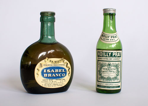 Noilly Prat and Isabel Branco, vintage liquor bottles that might best you in a showdown.