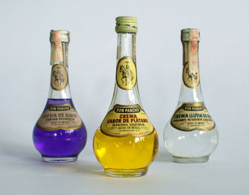 Three bottles of Liqueur: Crema de Amor, Crema Sabor de Platano and Crema Lluvia de Oro.