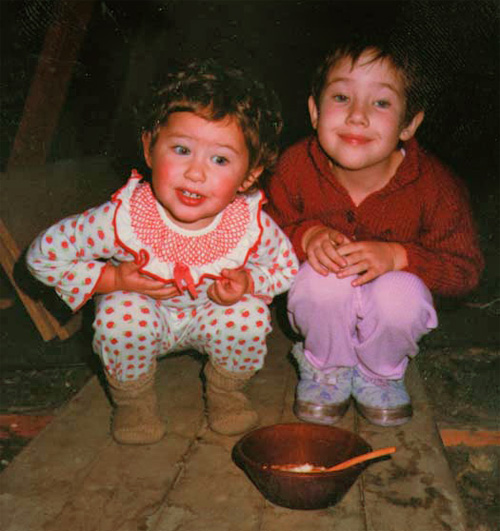 My sister and I pondering where the risengrød (rice porridge) went after putting it in the attic for the nisser (Christmas gnomes).