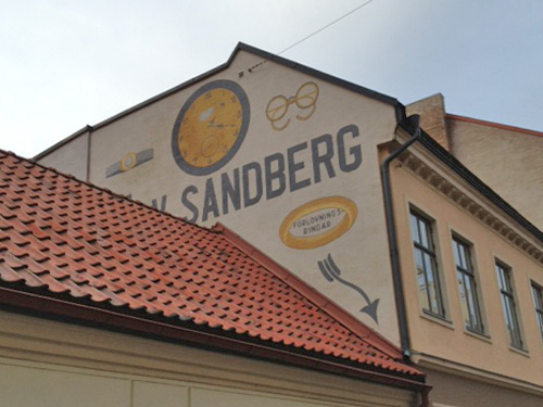 Painted advertising on a building facade in Malmø, Sweden.