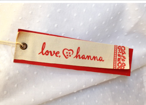 Love, Hanna logo used on the hangtag of the women's  clothing line.