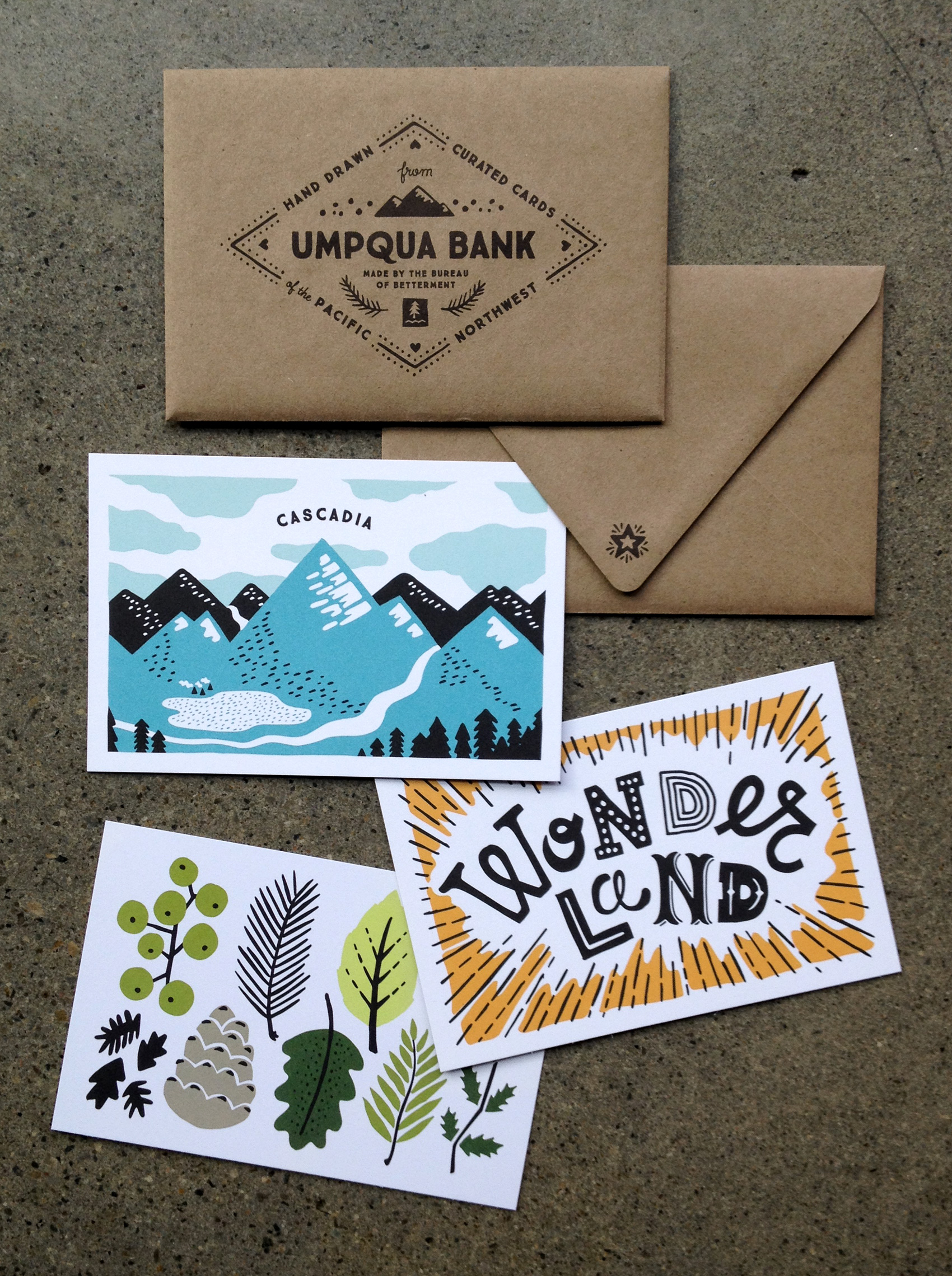 Northwest inspired hand drawn illustrations for Umpqua Bank. Three postcards including Cascadia mountain range, Wonderland typography, and Oregon foliage.